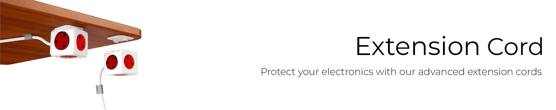 extension boards connected to a wall socket providing power to electronic devices 